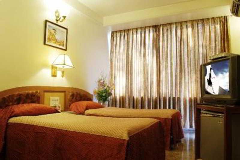 Hotel Mandakini Ambience Púna Szoba fotó